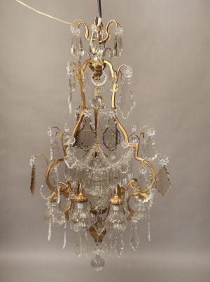 A Nice Early 20th Century Gilt Bronze and Crystal Nine Light Chandelier