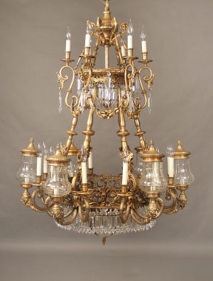 An Interesting Early 20th Century Gilt Bronze and Crystal Twenty Six Light "Grotesque" Chandelier