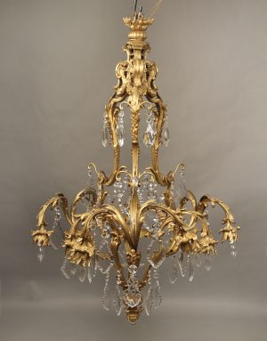 A Fine Early 20th Century Gilt Bronze and Crystal Eleven Light Chandelier