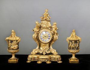 A Nice Late 19th Century Gilt and Patinated Bronze Three Piece Clock Set