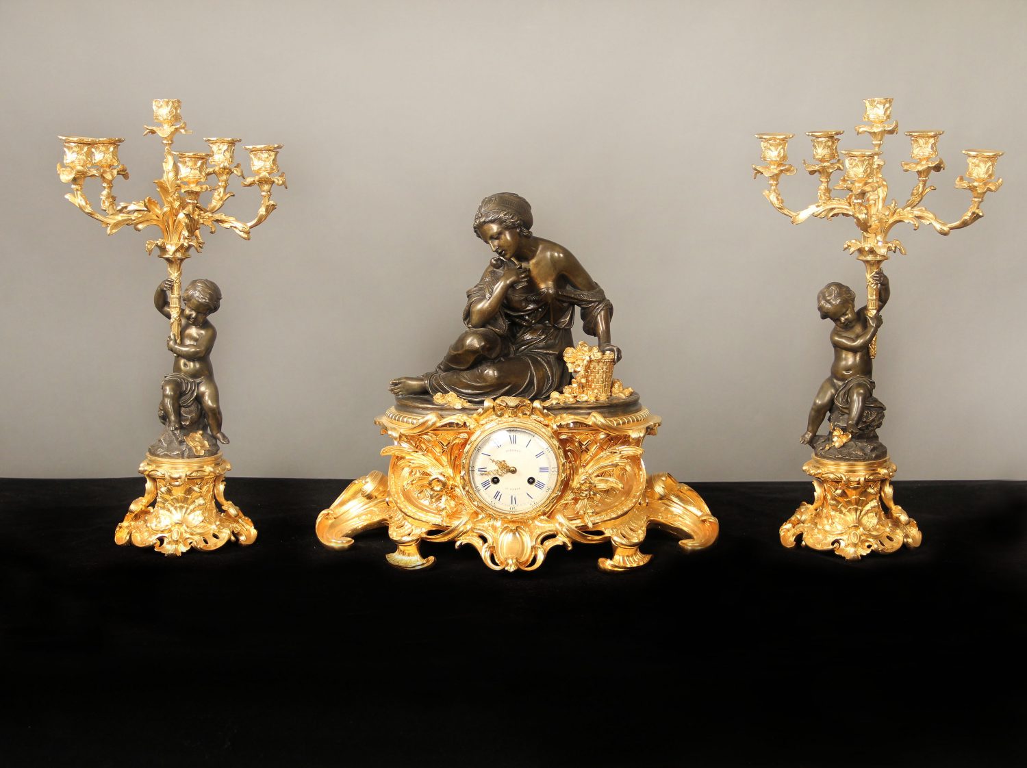 A Fine Mid 19th Century Gilt and Patinated Bronze Three Piece Clock Set By Victor Pierret