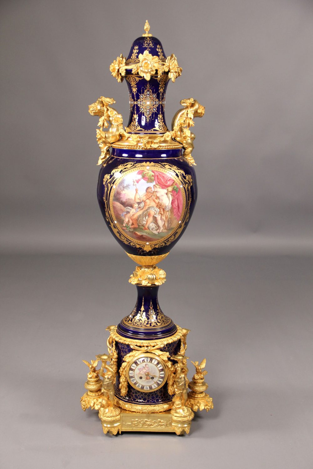 An Impressive Sèvres Style Gilt Bronze Mounted Porcelain Vase and Cover, the base with an Integral Clock