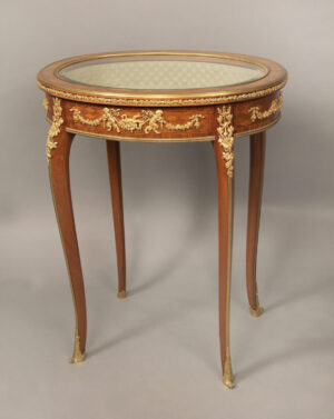 Round wooden side table by Francois Linke