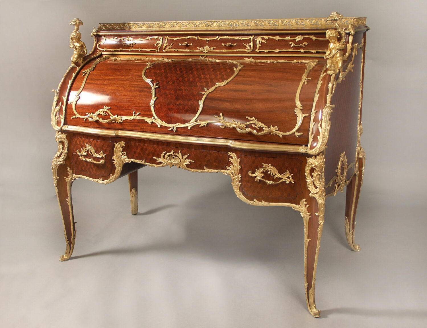 A Very Special and Palatial Early 20th Century Louis XV Style Gilt Bronze Mounted Mahogany and Bois Satine Parquetry Bureau a Cylindre By François Linke